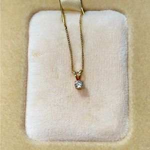 Diamond solitaire pendant on gold chain